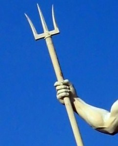 A trident being gripped by a muscular hero's arm.