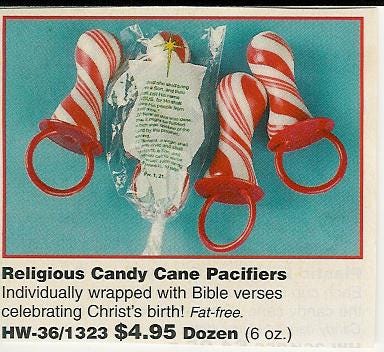 an advertisement for candy cane lollipops shaped like pacifiers with a caption about how they are religious and help celebrate the real meaning of Christmas