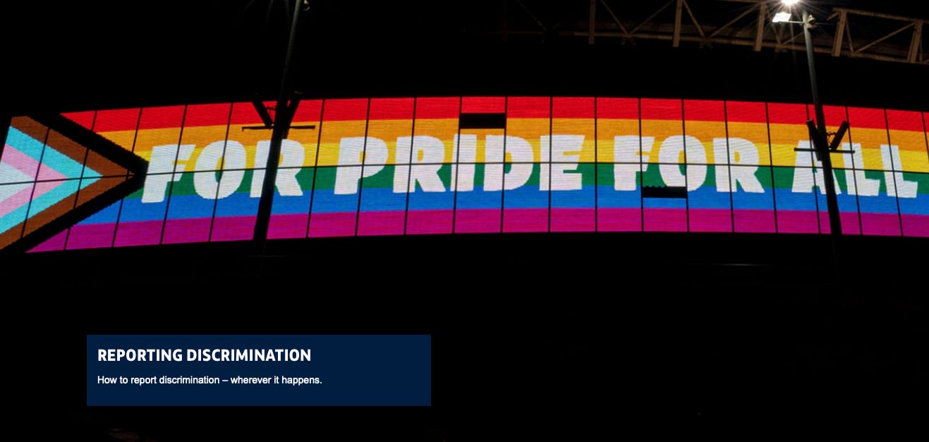 A rainbow colored sign with white text

Description automatically generated