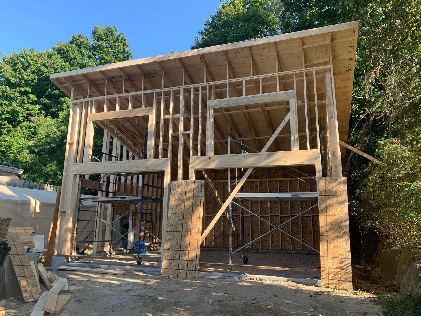 Garage progress, showing the rough framing of a two car garage