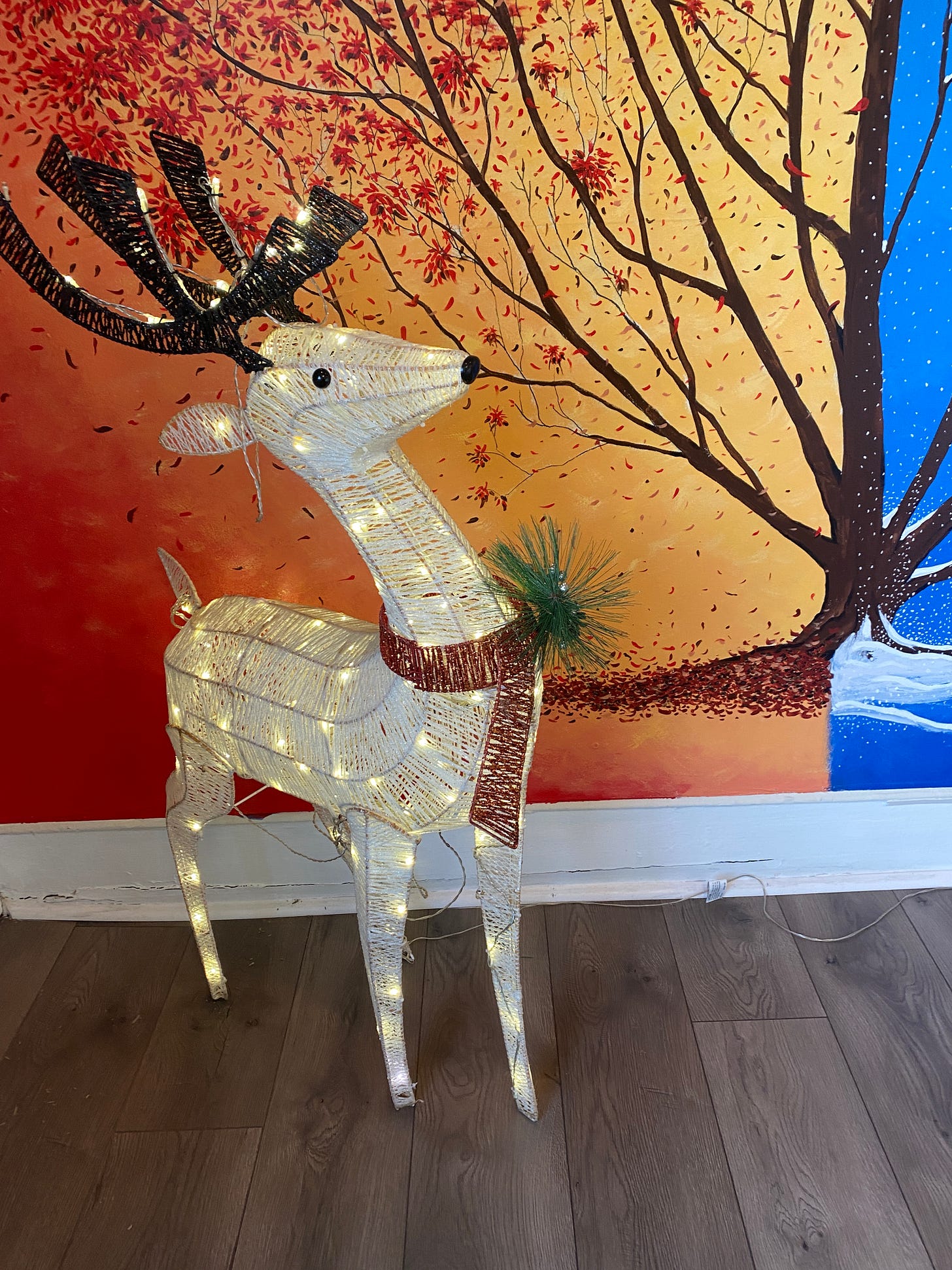 a model of a reindeer with twinkly lights