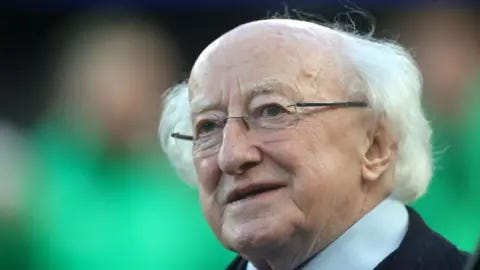 David Rogers/Getty Images DUBLIN, IRELAND - FEBRUARY 11: Michael D.Higgins, the Ireland President, looks on during the Guinness Six Nations 2024 match between Ireland and Italy at Aviva Stadium on February 11, 2024 in Dublin, Irelan