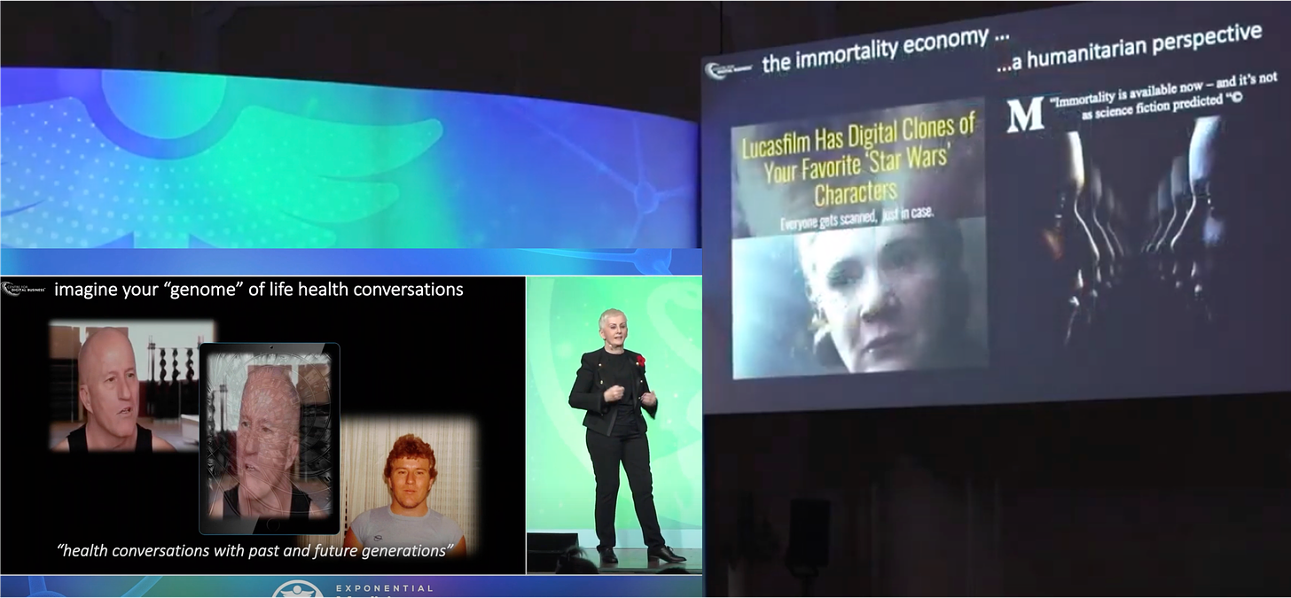 Image: Background black, dark blue and green. A woman with short blond hair, wearing a dark suit, gold buttons. Presenting on stage. Two slides either side of the woman, text on slides reads ‘the immortality economy’ and ‘imagine the genome of life health conversations’.