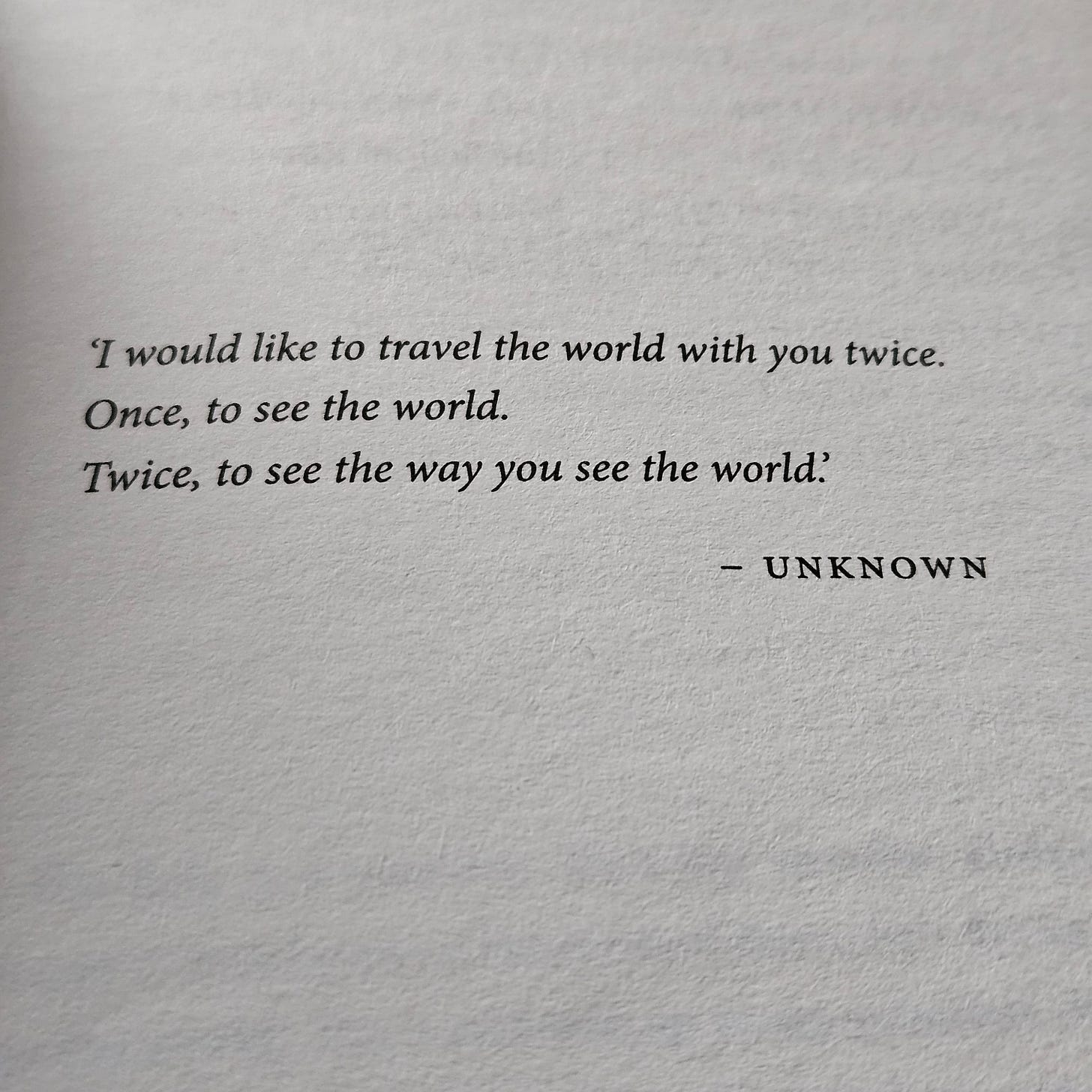 A book opening page stating, 'I would like to travel the world with you twice. Once, to see the world. Twice, to see the way you see the world.'