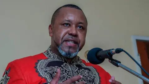 AFP Malawi's former Vice-President Saulos Chilima wearing a red and black African print shirt