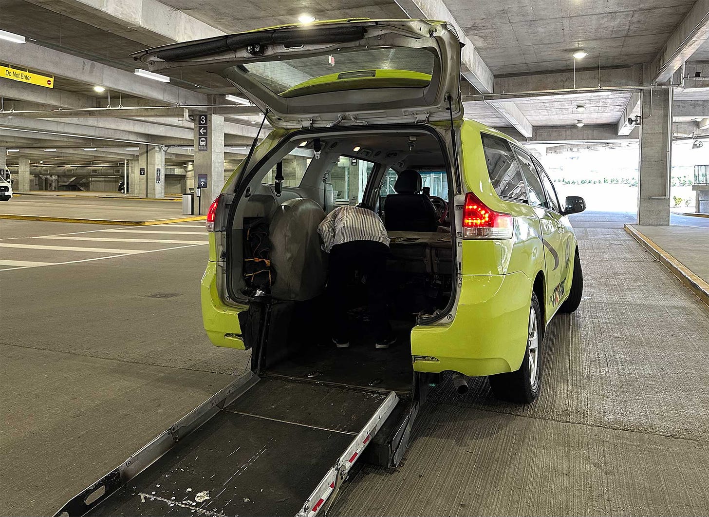 Nashville wheelchair taxi with rear ramp extended.