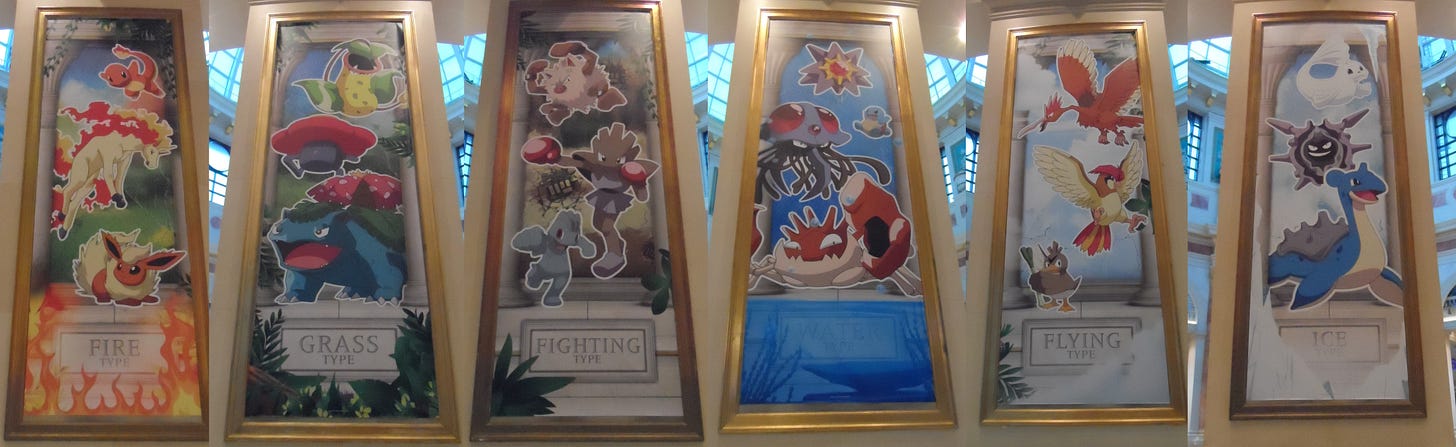 Huge pieces of artwork featuring Pokémon of different types, decorated an area of the Trafford Center