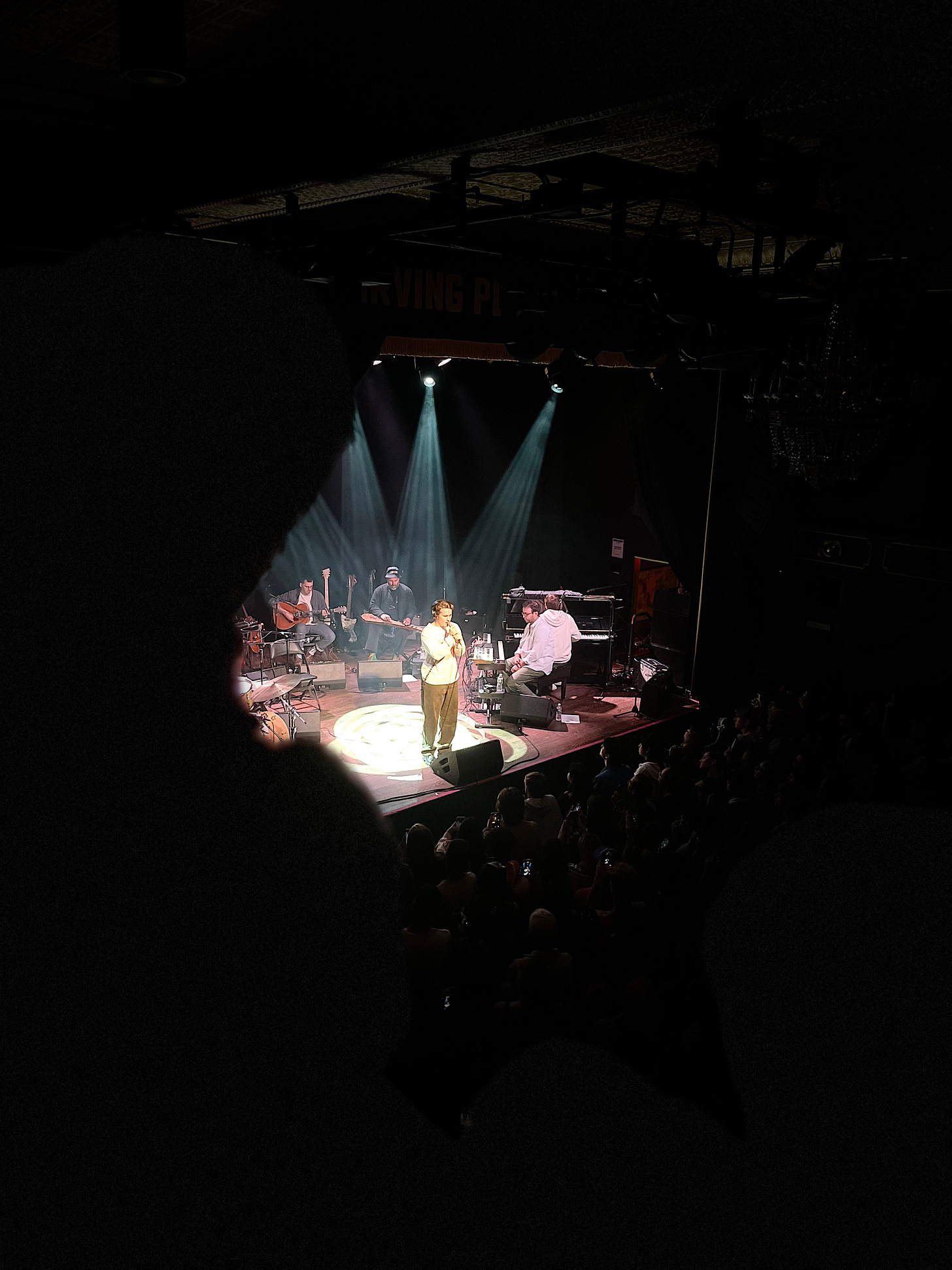 ryan beatty singing on stage at a concert