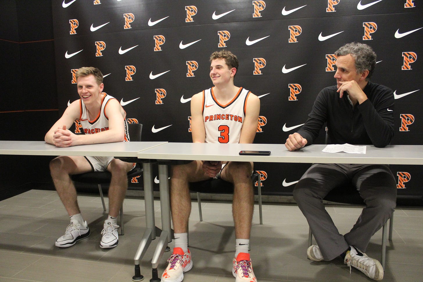 From left to right, Matt Allocco, Caden Pierce and Mitch Henderson speak with the media after a win on Dec. 2, 2023. (Photo by Adam Zielonka)