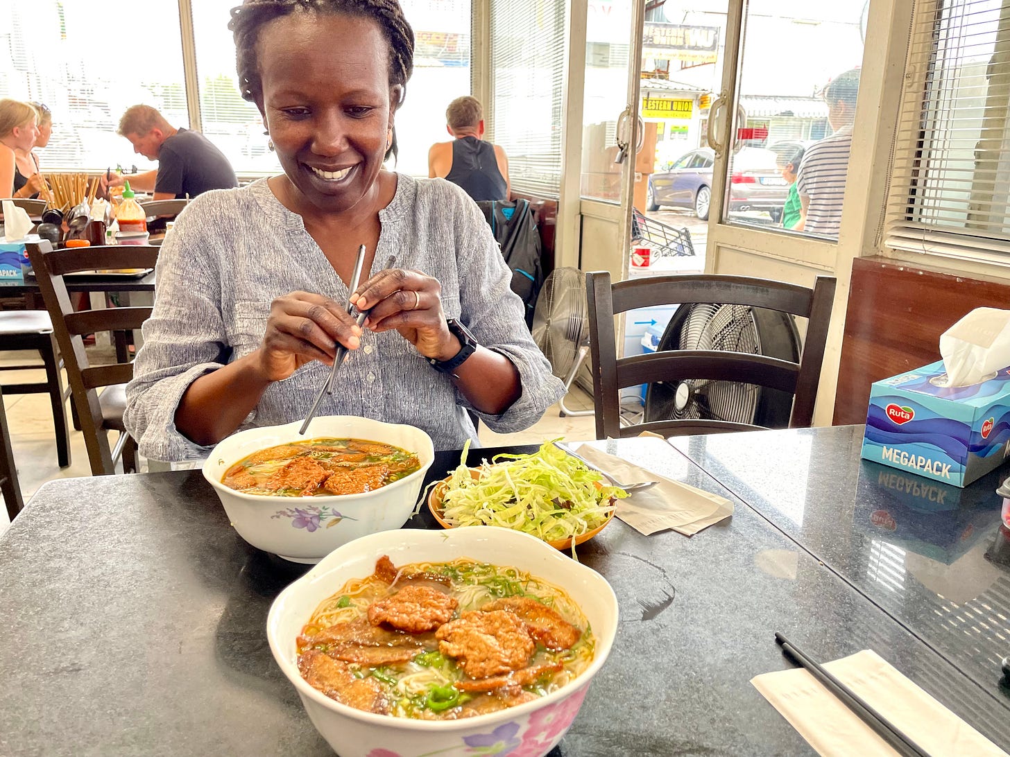 Rosemary eating Bún Cả fish noodle soup in Sapa Market for Substack by Authentic Food Quest