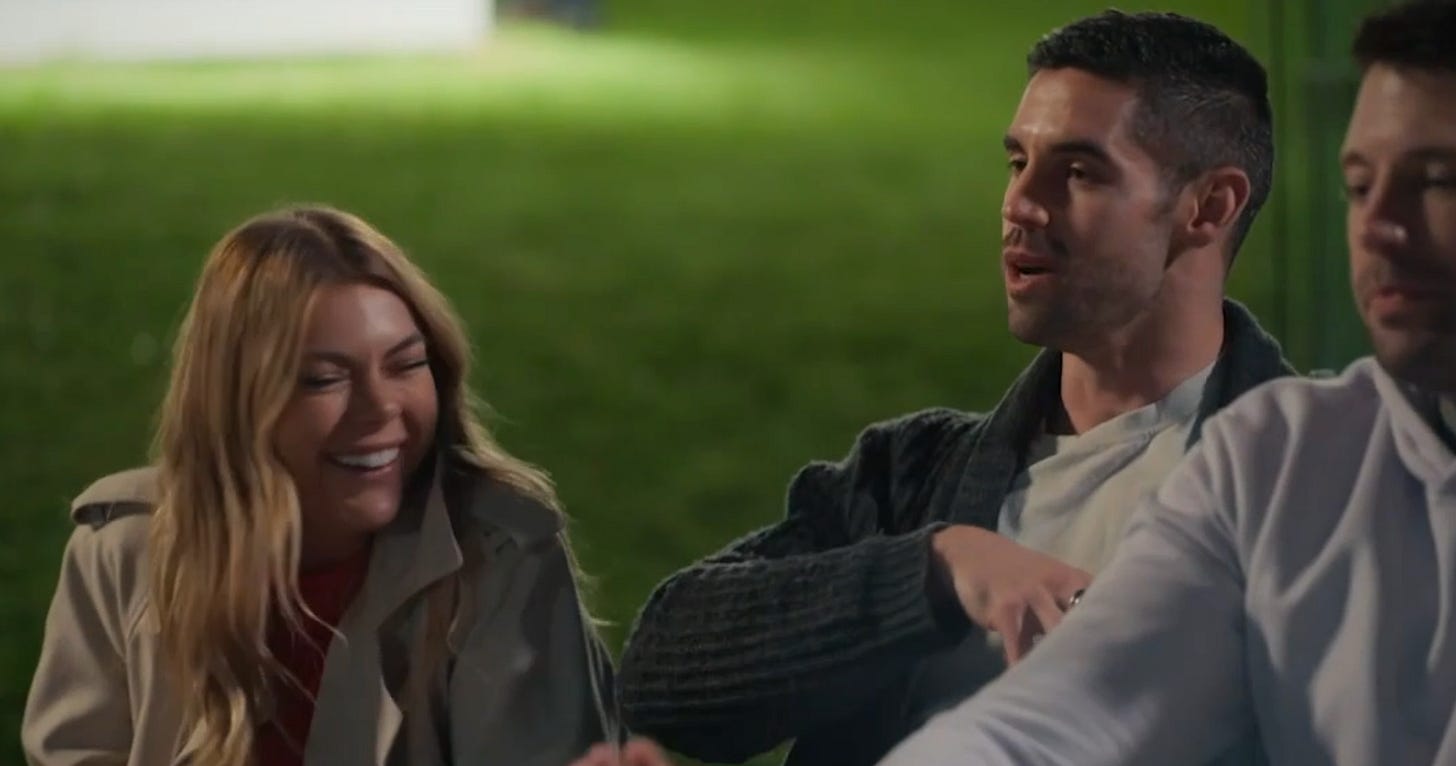 Jacqui and Ryan from MAFS 2025 share a laugh at an outdoor gathering, with Ryan mid-conversation