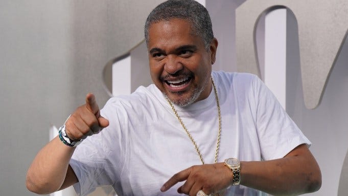 Irv Gotti smiles and points his finger.