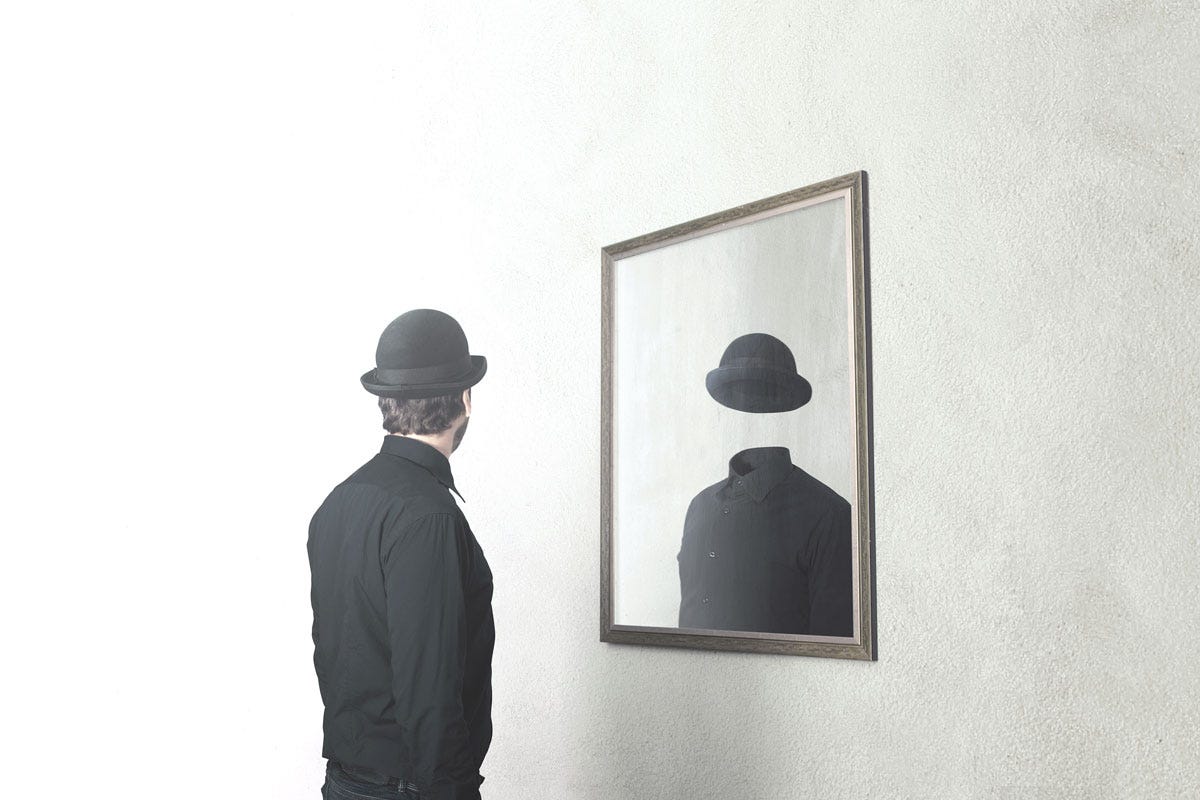 Behind the Scenes: Doublethink; Man Looking Away from Headless Reflection