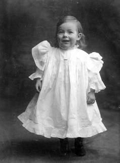 a boy in a white dress a boy in a white dress