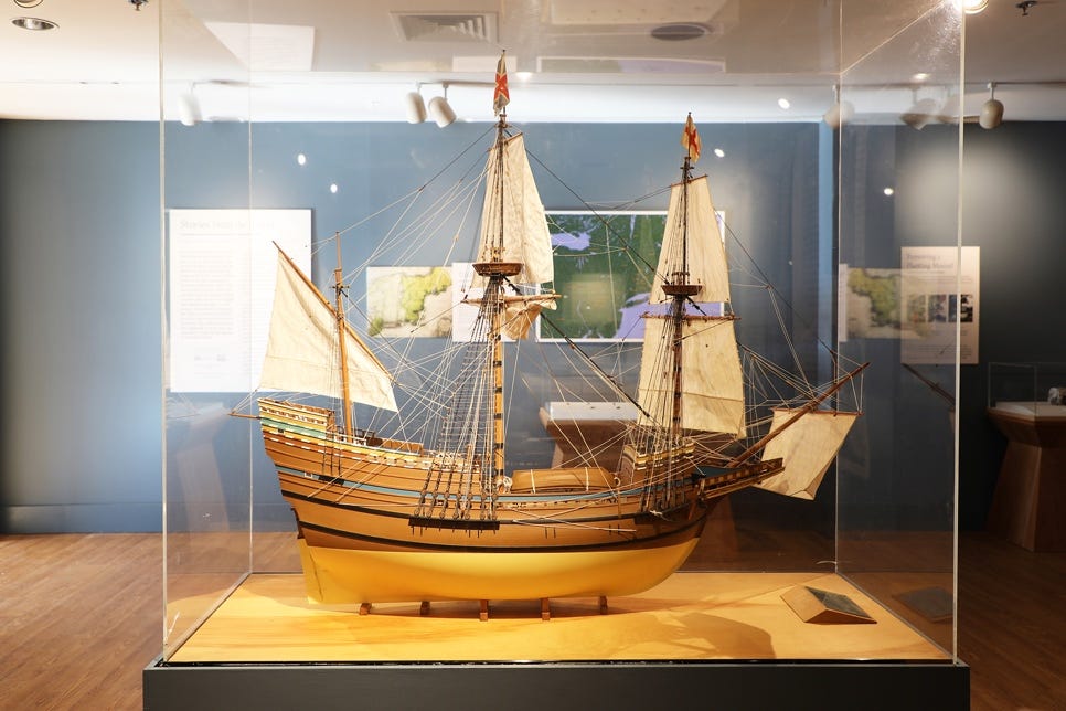 A model of a ship in a glass case

Description automatically generated