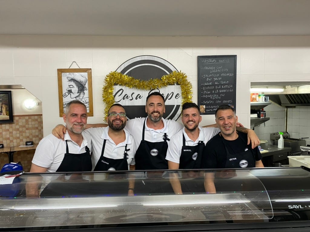 Five men in a café