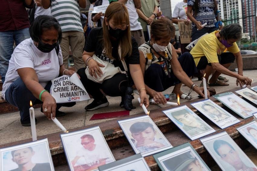 Relatives of “drug war” victims light candles after the International Criminal Court allowed the ICC prosecutor to resume his investigation into alleged crimes against humanity in the Philippines, Quezon City, July 18, 2023. 