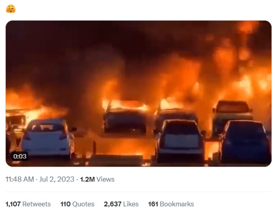 tweet of cars on fire in parking lot.