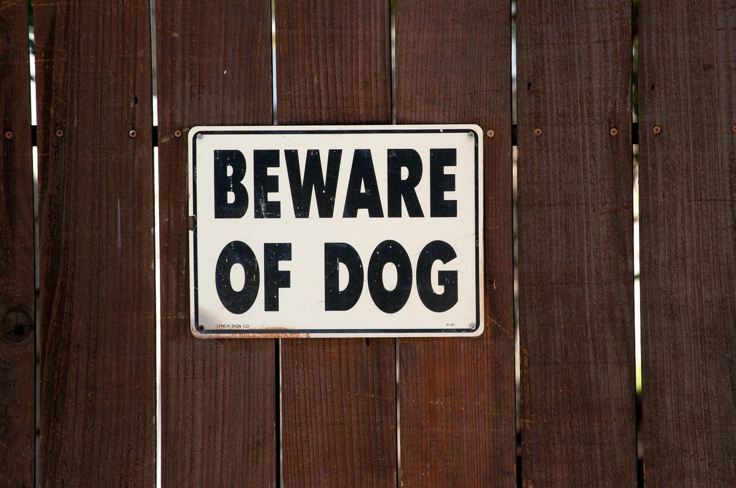 Beware Of Dog Sign On Brown Fence Free Stock Photo - Public Domain Pictures