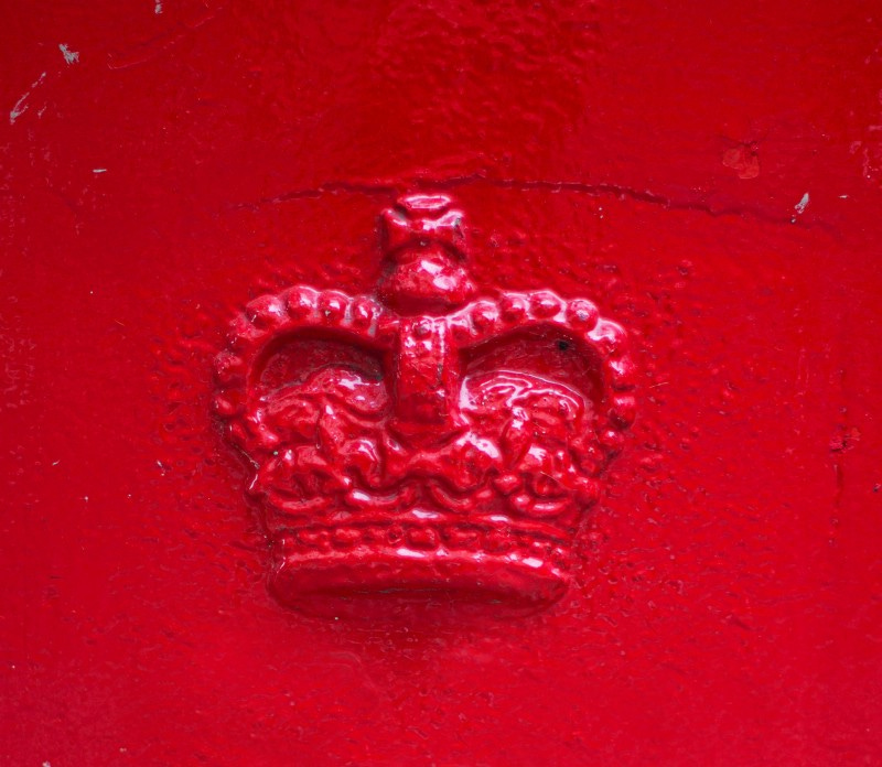 HRM crown symbol cast in iron and painted red.