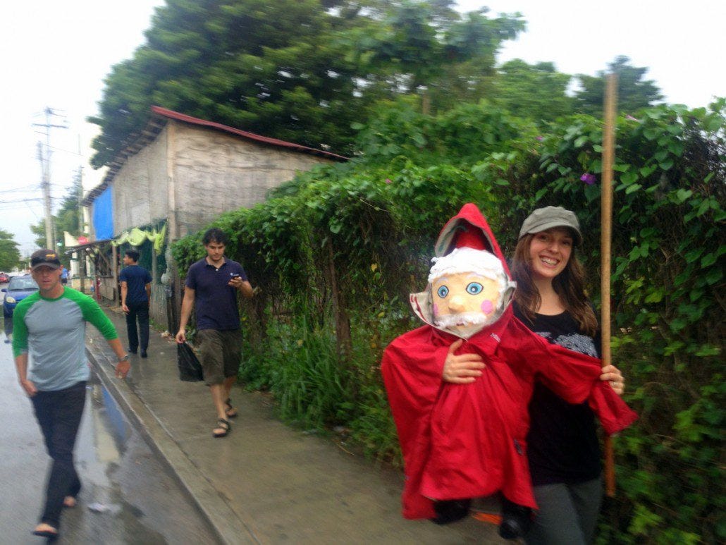 When in Rome... Chelsea protects a Santa pinata enroute to a party. Not every day you see Santa wearing a Marmot rainjacket.