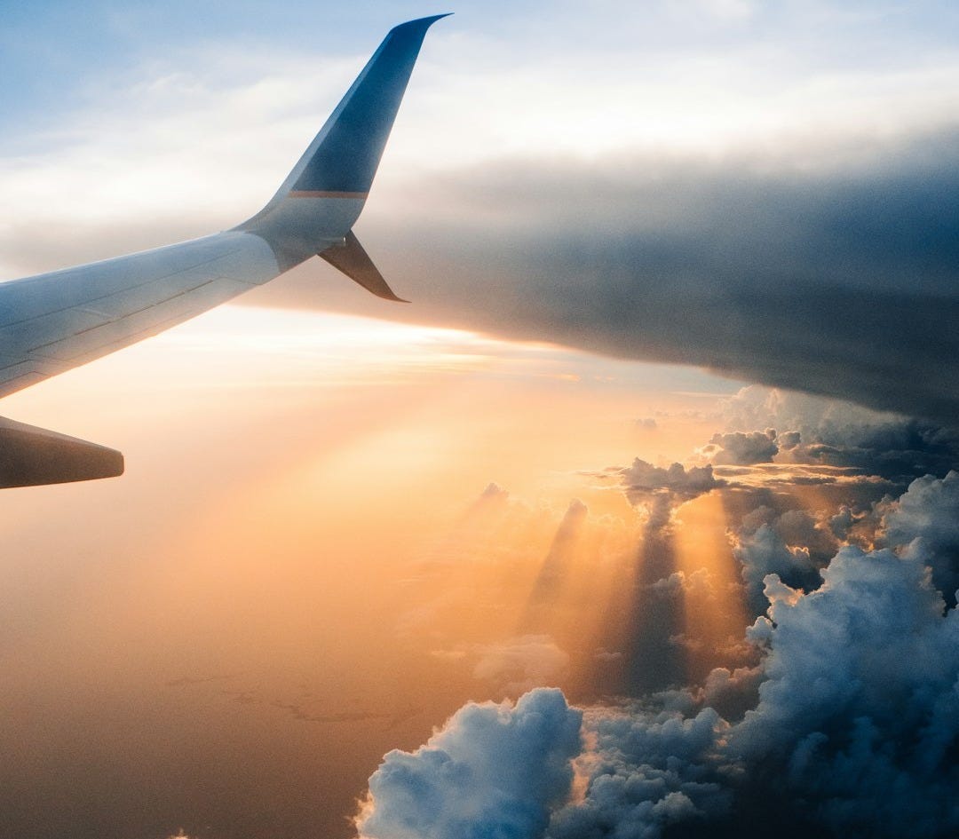airplane on sky during golden hour