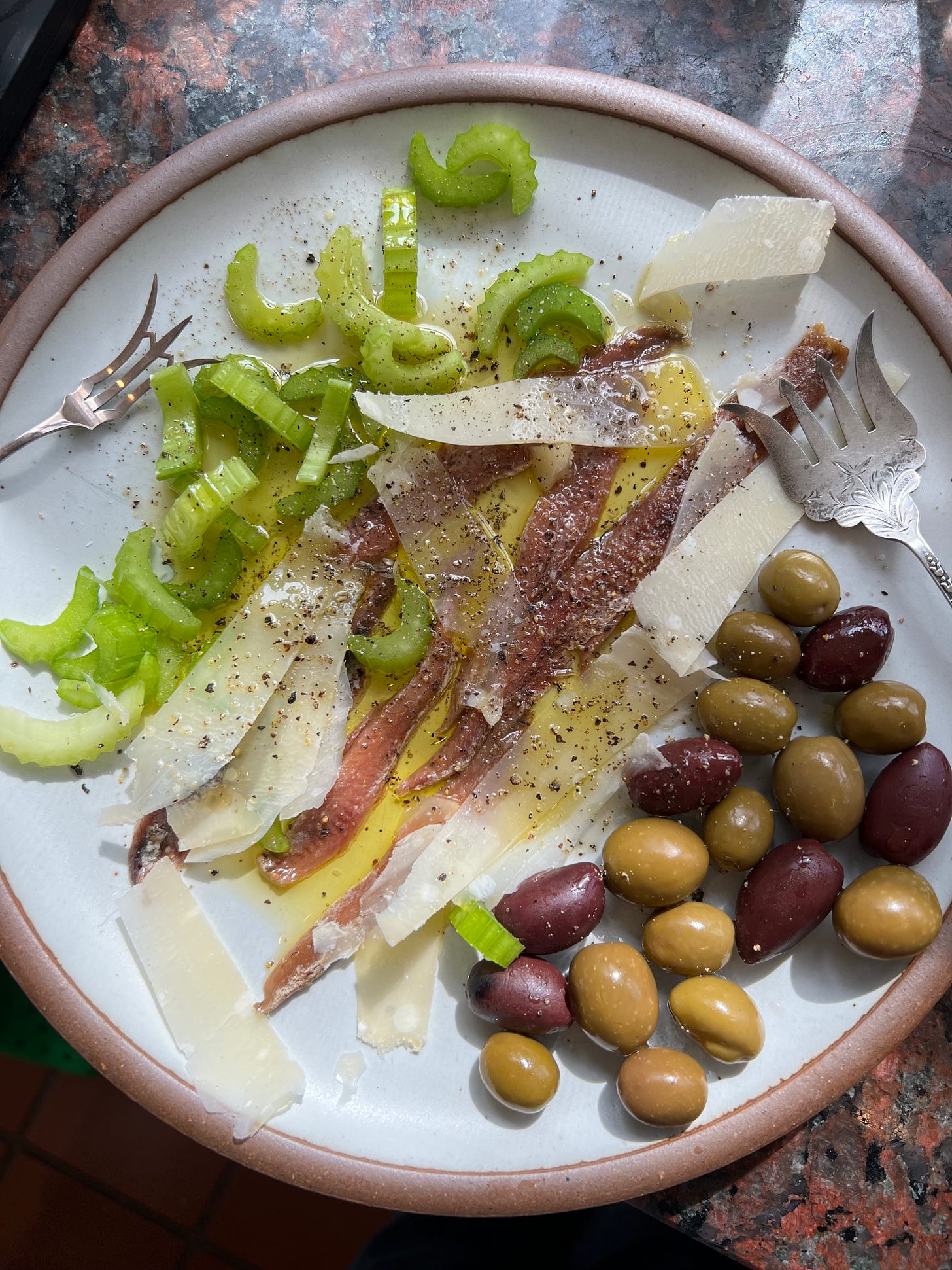 Plate of celery, anchovies, olives. Plate of celery, anchovies, olives.