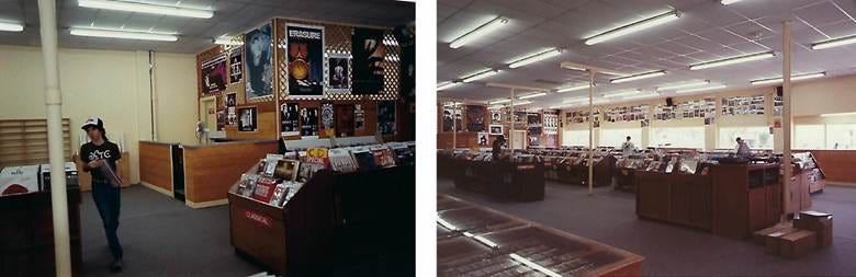 A room with a lot of books and posters

Description automatically generated with medium confidence