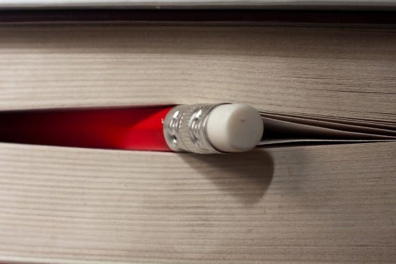 Photo of a pencil in a book for essay on finishing what you start