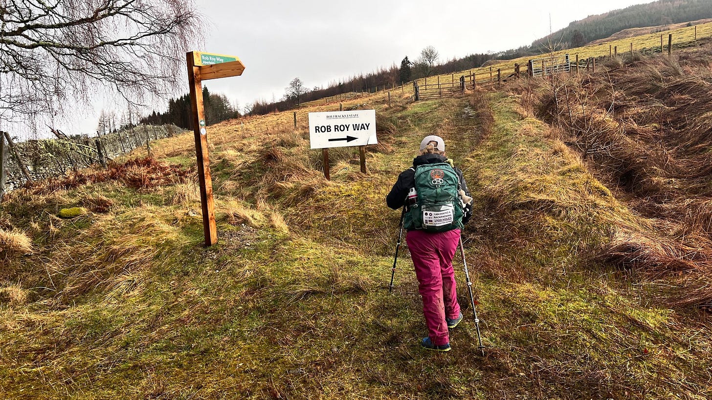 Eve just starting to head uphill across a short section of wet grass 