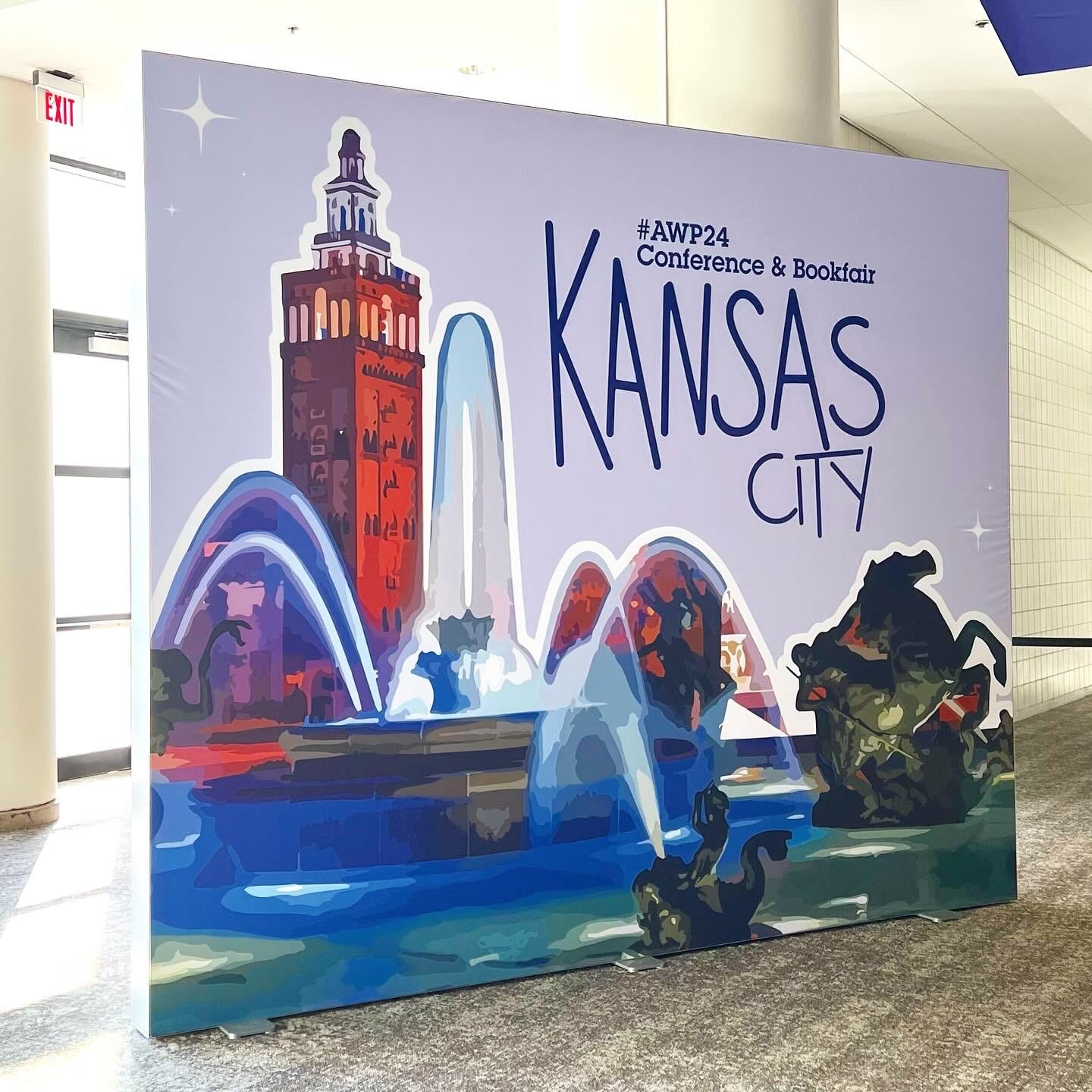 A big banner/sign advertising the AWP conference in Kansas City