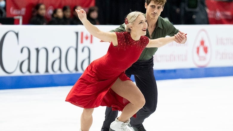 Ice dancers perform during Skate Canada International competition.