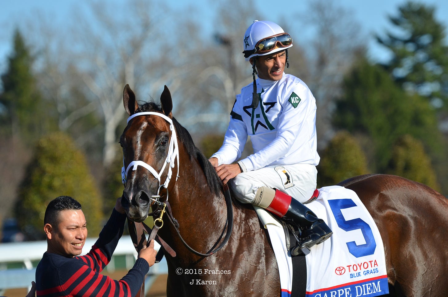 WinStar- and Stonestreed-raced Carpe Diem, trained by Todd Pletcher, in the winners’ circle with John Velazquez after the G1 Blue Grass at Keeneland.