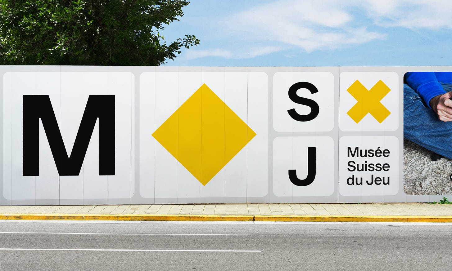 Mural design for Musée Suisse du Jeu with large letters "M", "S", "J", a yellow diamond, a yellow "X", and the text "Musée Suisse du Jeu".