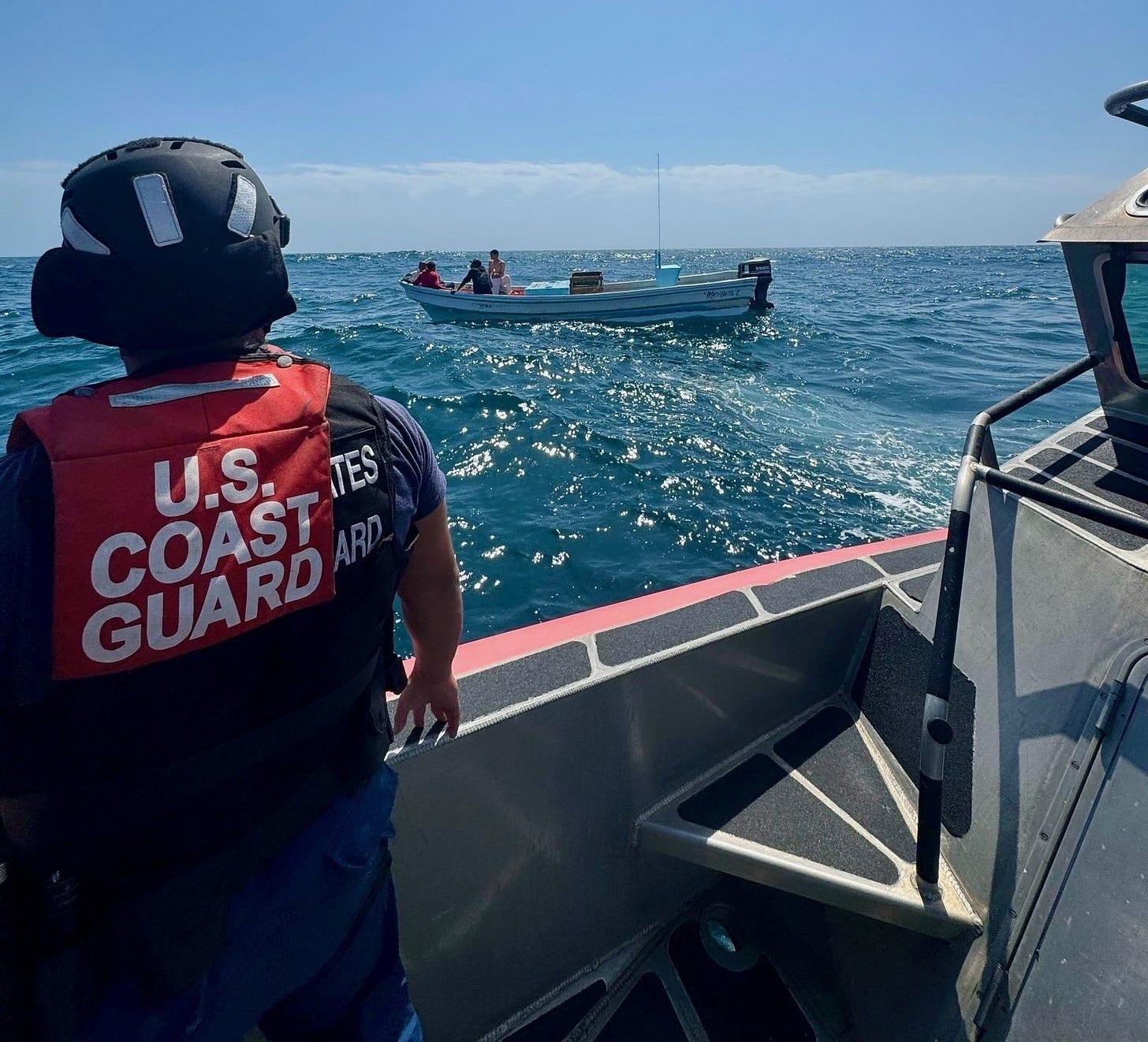 A US Coast Guard Patrol Boat approaches a Mexican Cartel "lancha" illegally fishing in Gulf waters off South Padre Island, Texas. A US Coast Guard Patrol Boat approaches a Mexican Cartel "lancha" illegally fishing in Gulf waters off South Padre Island, Texas.