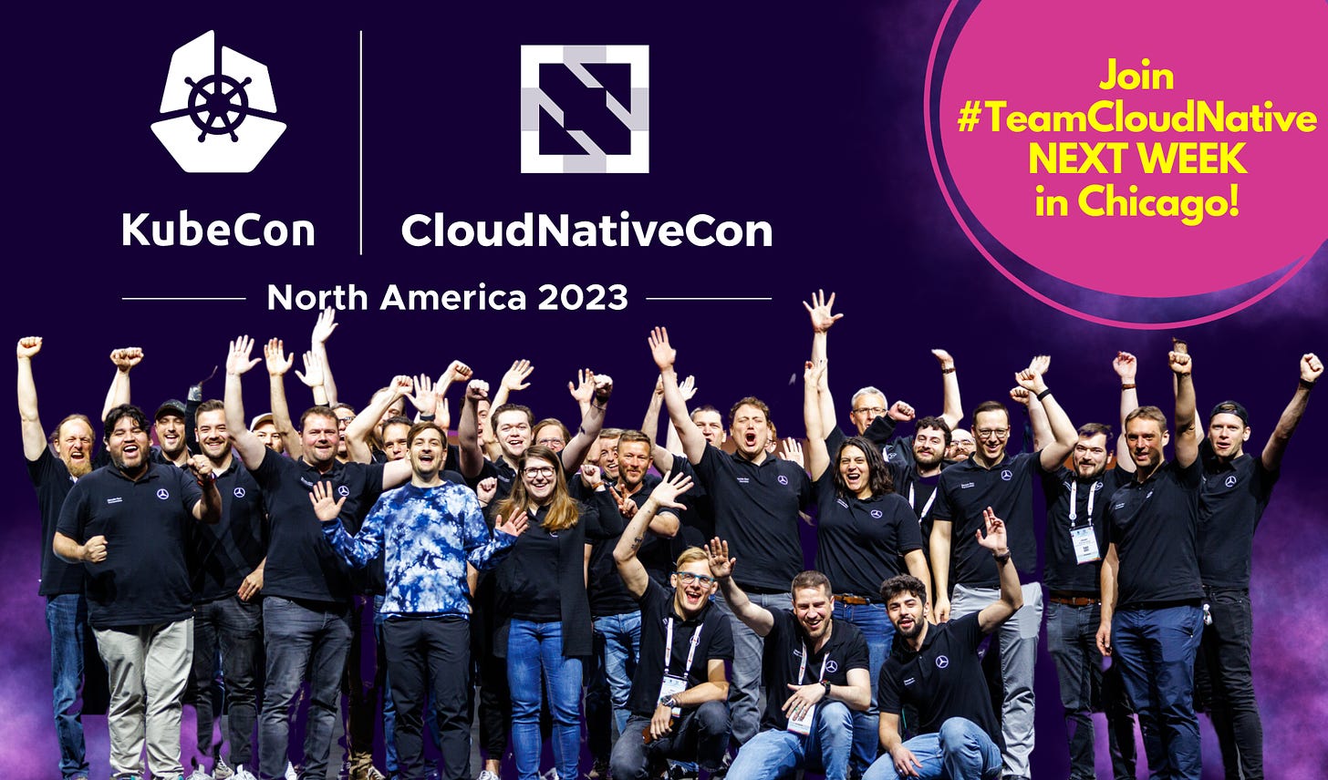 A group of excited looking people in front of a purple-ish backdrop advertising KubeCon