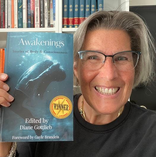 Beautiful woman holding book titled Awakening with picture of woman in a dress in water