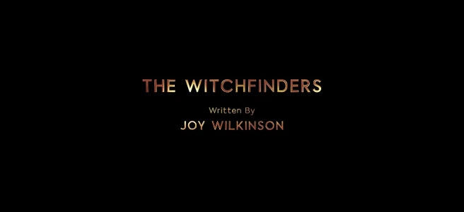 This image shows the title card for "The Witchfinders" (Doctor Who Series 11's eighth episode). Joy Wilkinson's writing credit appears below the episode's title. All letters appear in reddish-golden type. This image shows the title card for "The Witchfinders" (Doctor Who Series 11's eighth episode). Joy Wilkinson's writing credit appears below the episode's title. All letters appear in reddish-golden type.