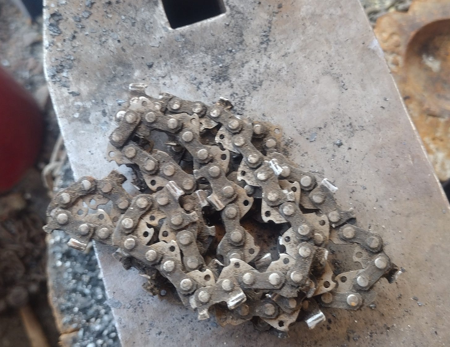 An old chainsaw chain on an anvil