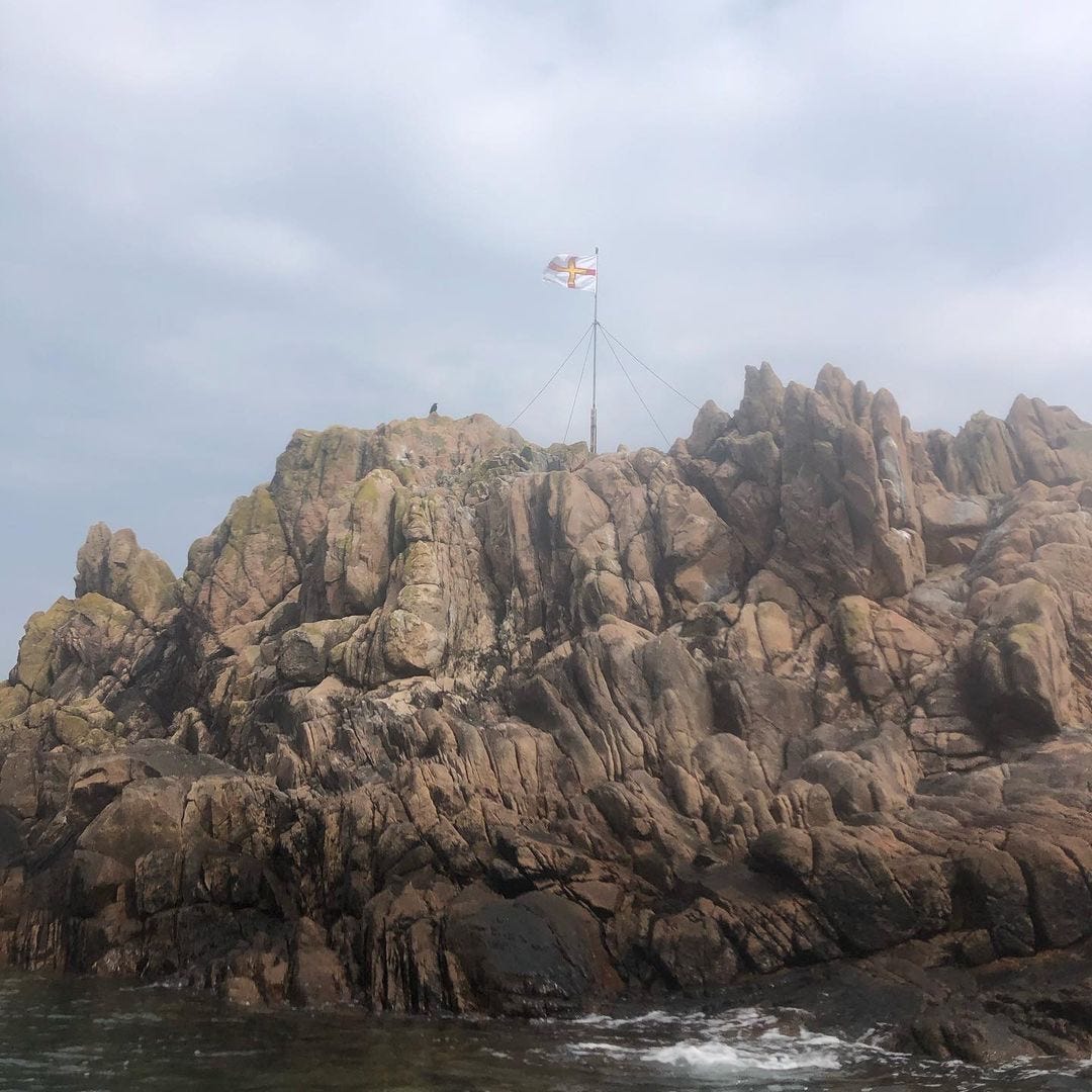  “Paddled past Grosse Rocque this morning. It was great to see the new flag flying at Flagrock on the west coast” Caption and Photo by Outdoor Guernsey