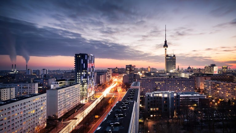 May be an image of skyscraper, the Reichstag Dome, twilight, buildings, sky and tower May be an image of skyscraper, the Reichstag Dome, twilight, buildings, sky and tower