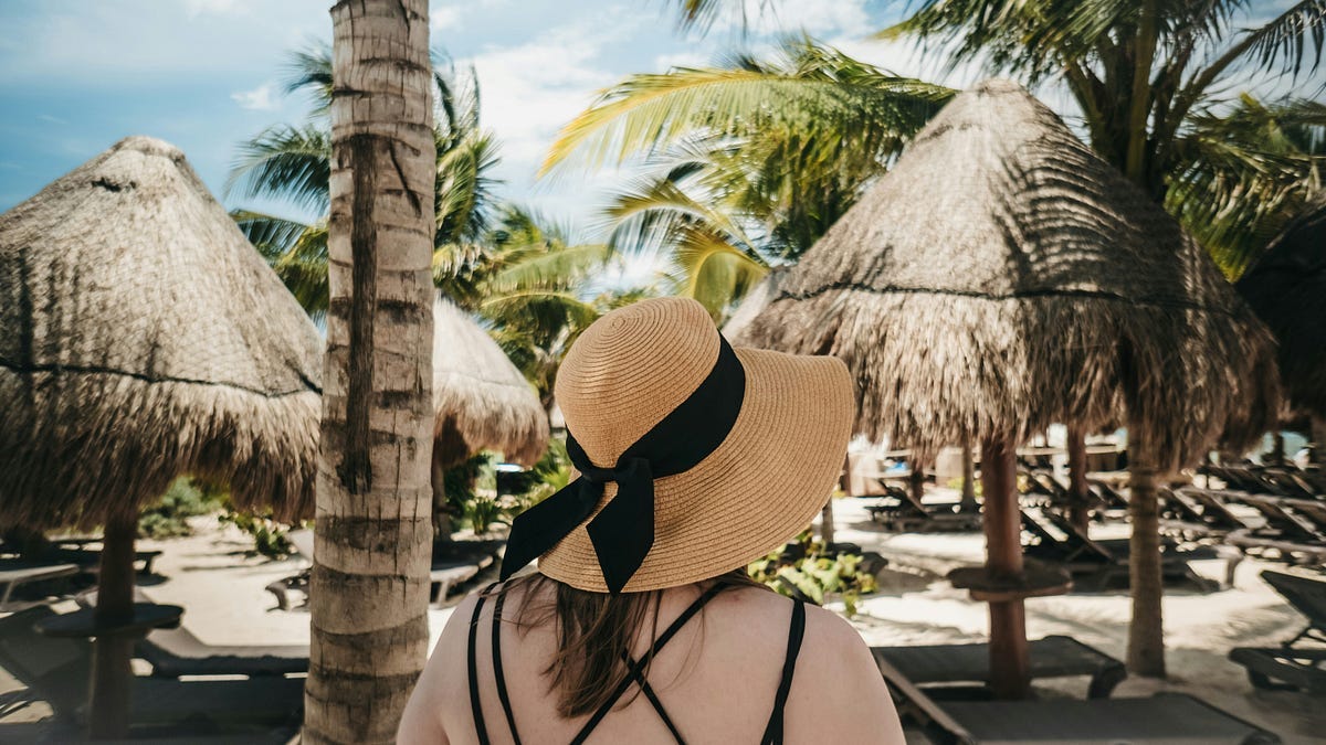 Person with a straw hat Person with a straw hat