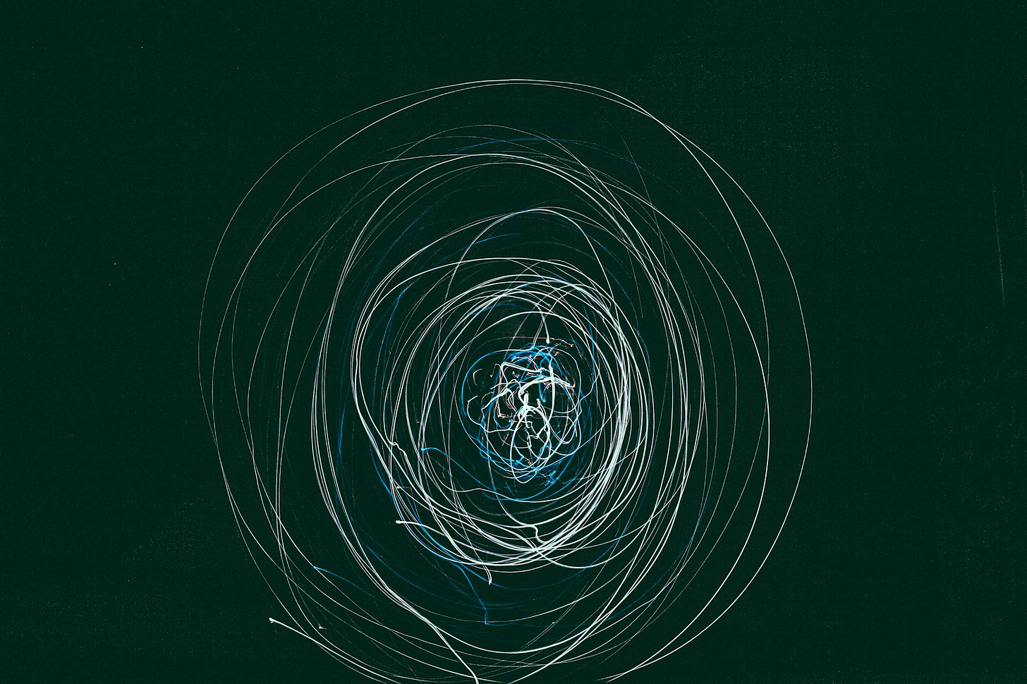 photo of steel wool against black background photo of steel wool against black background