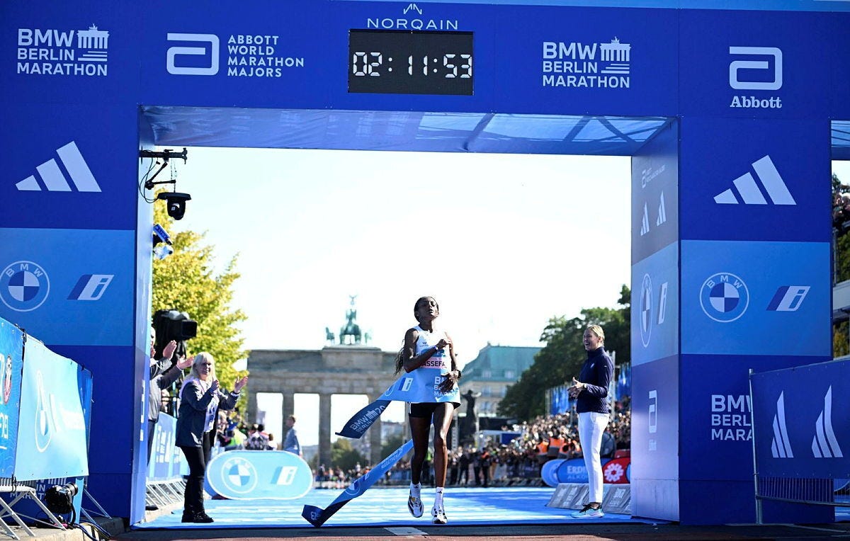 Ethiopia’s Tigist Assefa crosses the finish line during the 2023 Berlin Marathon in a world record time of 2:11:53