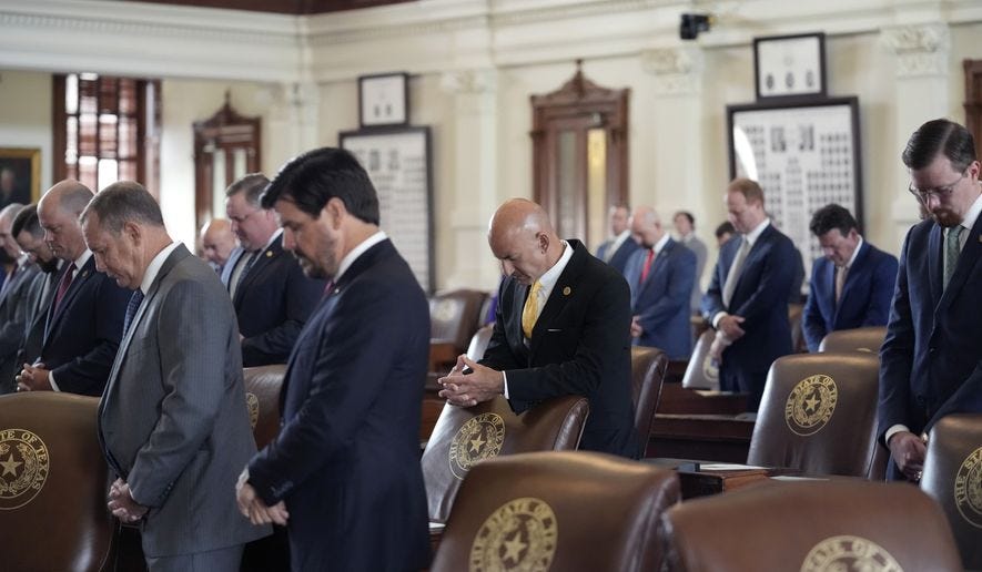 Members of the Texas House stand for a prayer as the House begins a special session, Thursday, July 8, 2021, in Austin, Texas. (AP Photo/Eric Gay) ** FILE **