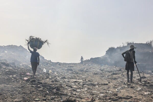 Rubbish pickers walk in the Kingtom landfill in Freetown, Sierra Leone, Thursday, March 13, 2025, a place where addicts meet the cartel that provides them with Kush. (AP Photo/Caitlin Kelly) Rubbish pickers walk in the Kingtom landfill in Freetown, Sierra Leone, Thursday, March 13, 2025, a place where addicts meet the cartel that provides them with Kush. (AP Photo/Caitlin Kelly)