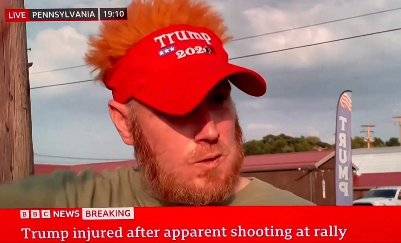 Man with orange hair and Trump hat