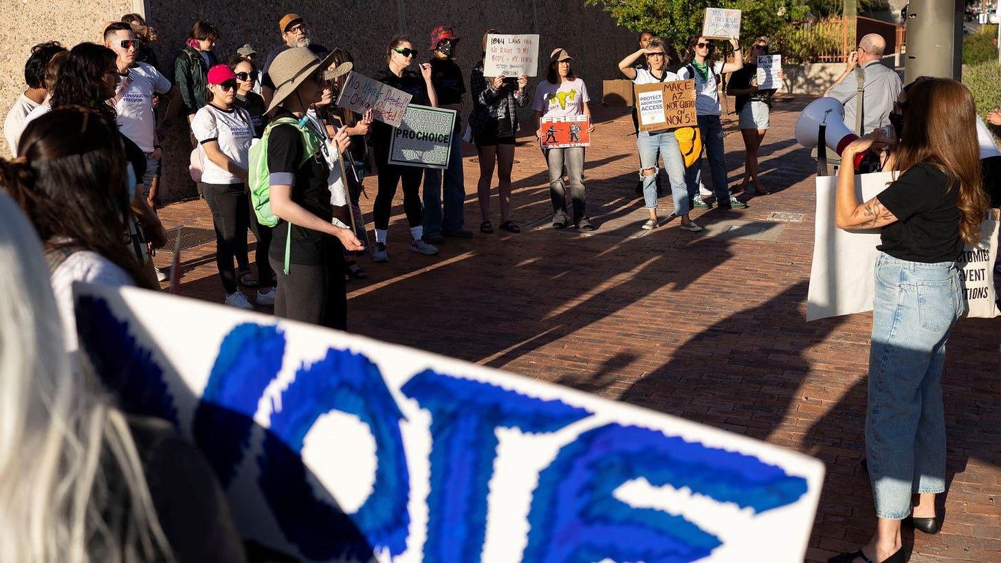 Protesters take part in a small rally led by Women's March Tucson after Arizona's Supreme Court revived a law dating to 1864 that bans abortion in virtually all instances, in Tucson, Arizona, on April 9, 2024.