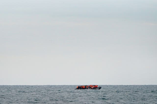 <p>File photo of migrants crossing the English Channel in a small boat</p>