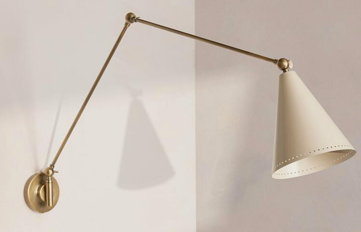 wall light in cream with extendable arm